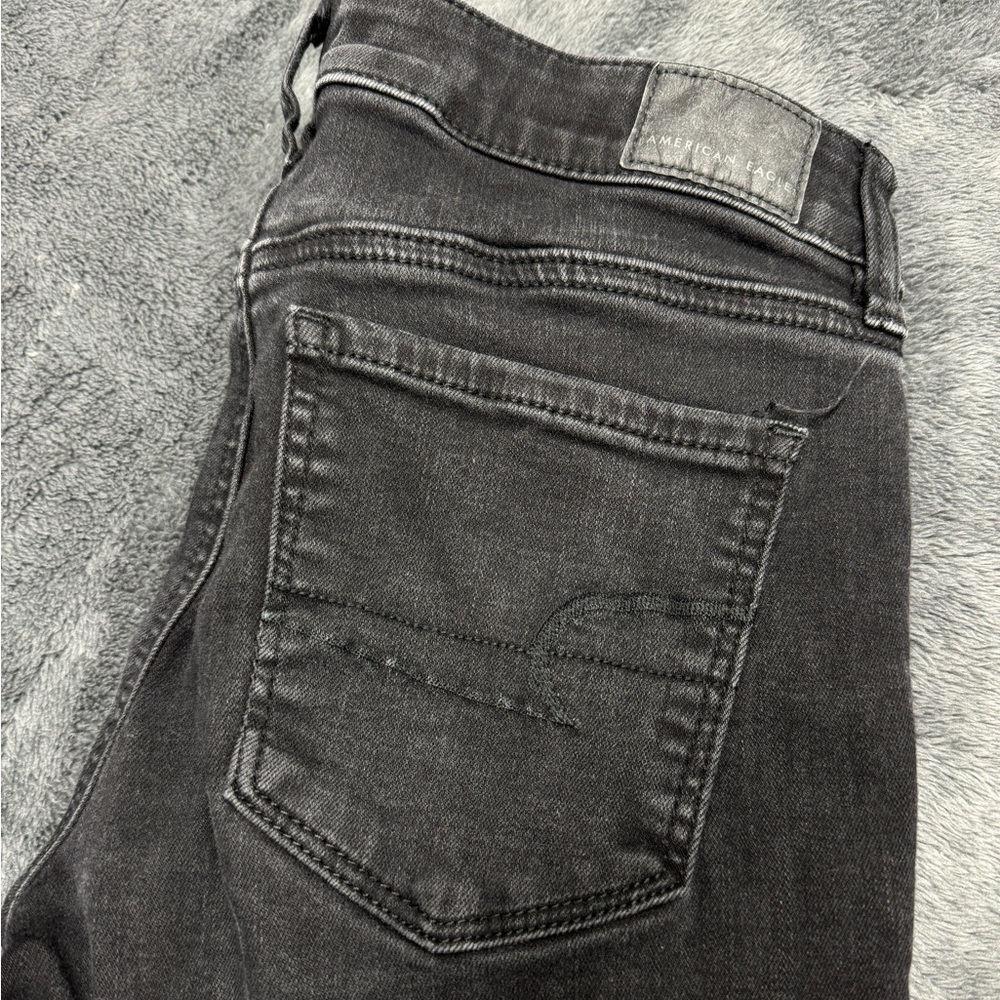 American Eagle Women’s Distressed Stretch Jeans, Size 2 and color is black.